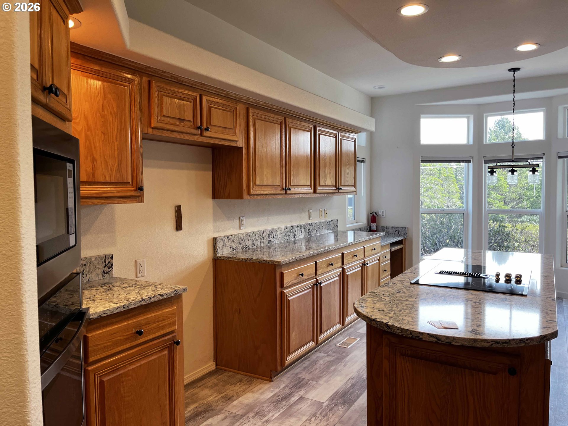 614 38th Place Florence, OR 97439 - Photo 15 of 48 a kitchen with stainless steel appliances granite countertop a sink stove and refrigerator