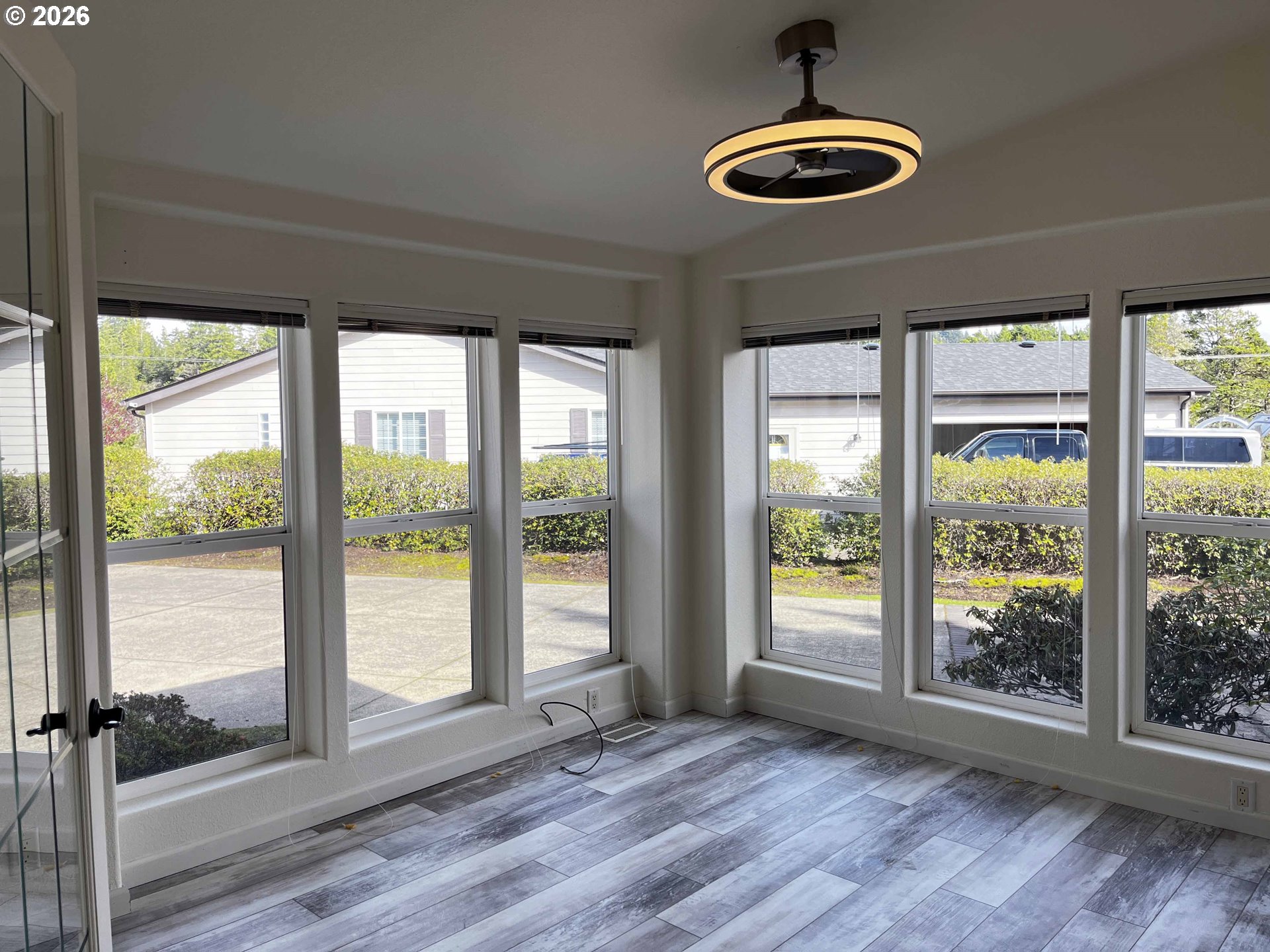 614 38th Place Florence, OR 97439 - Photo 19 of 48 a view of outdoor space with wooden floor and windows