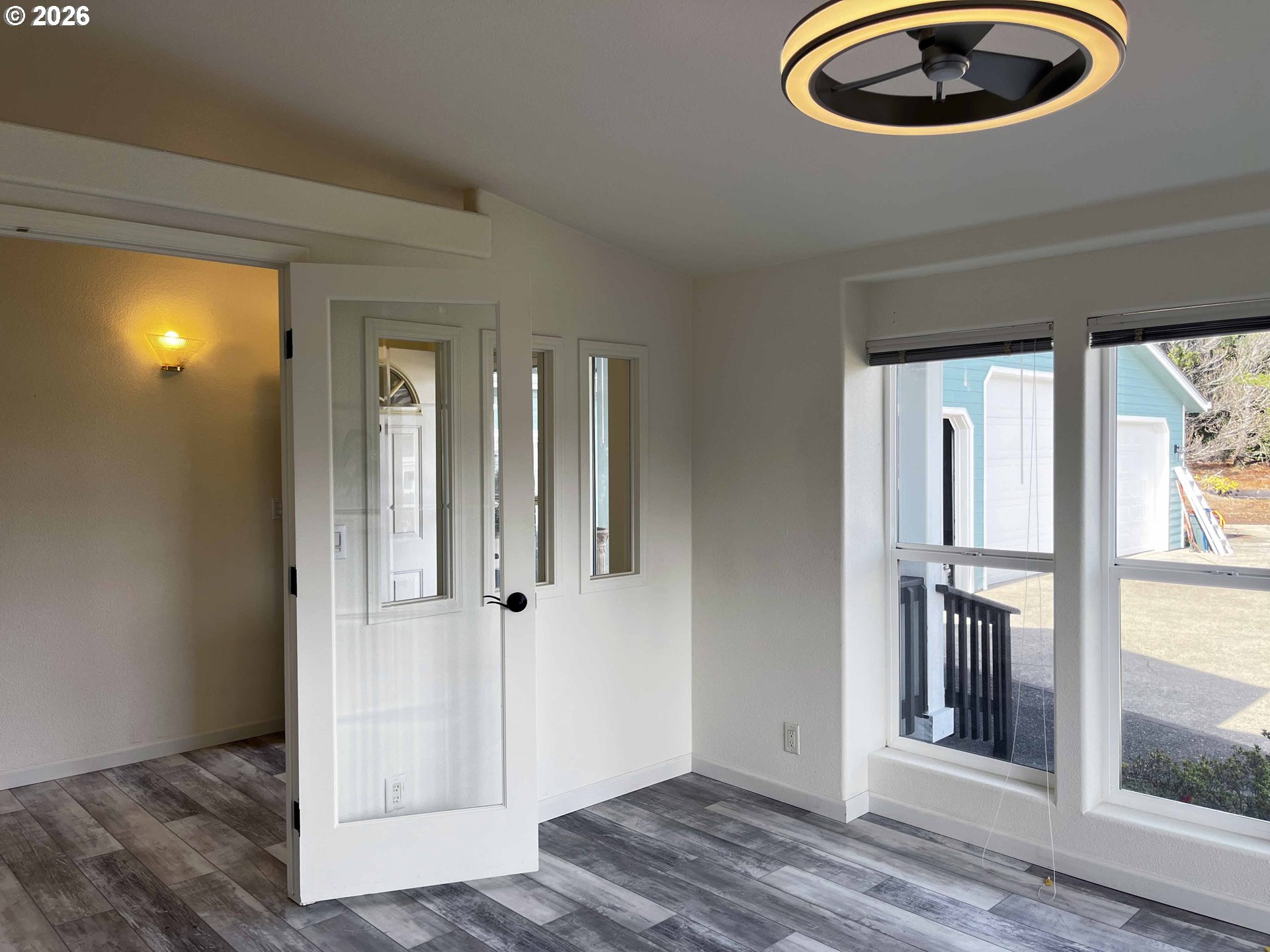 614 38th Place Florence, OR 97439 - Photo 20 of 48 an entryway to room with wooden floor and windows