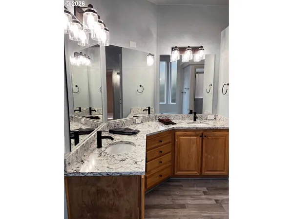 a bathroom with a sink double vanity and a mirror