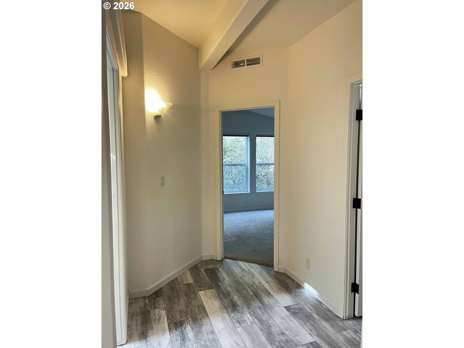 614 38th Place Florence, OR 97439 - Photo 33 of 48 a view of a hallway with wooden floor