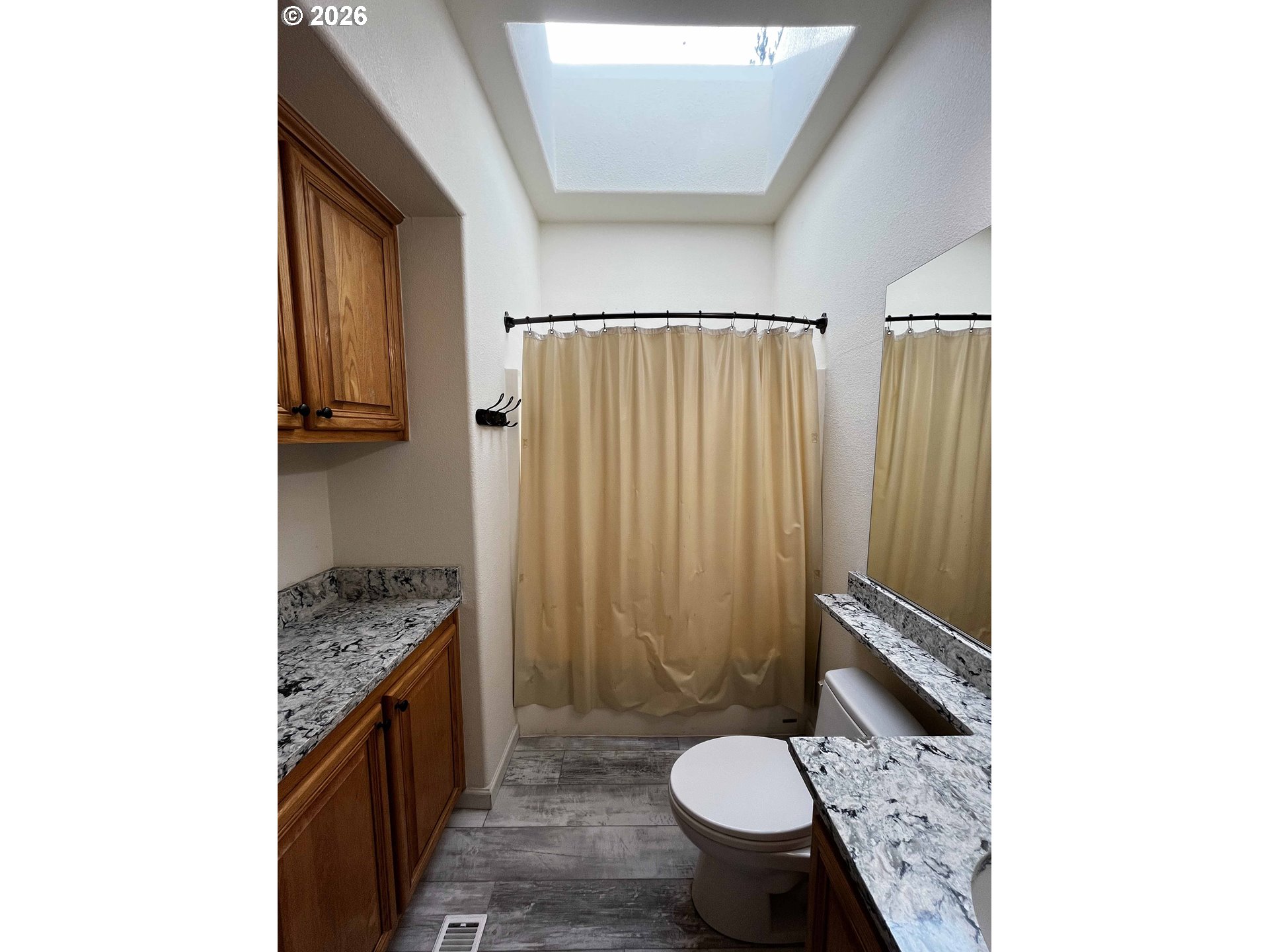 614 38th Place Florence, OR 97439 - Photo 37 of 48 a bathroom with a granite countertop sink toilet and shower