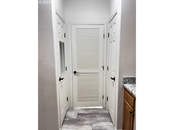 a view of a hallway with closet