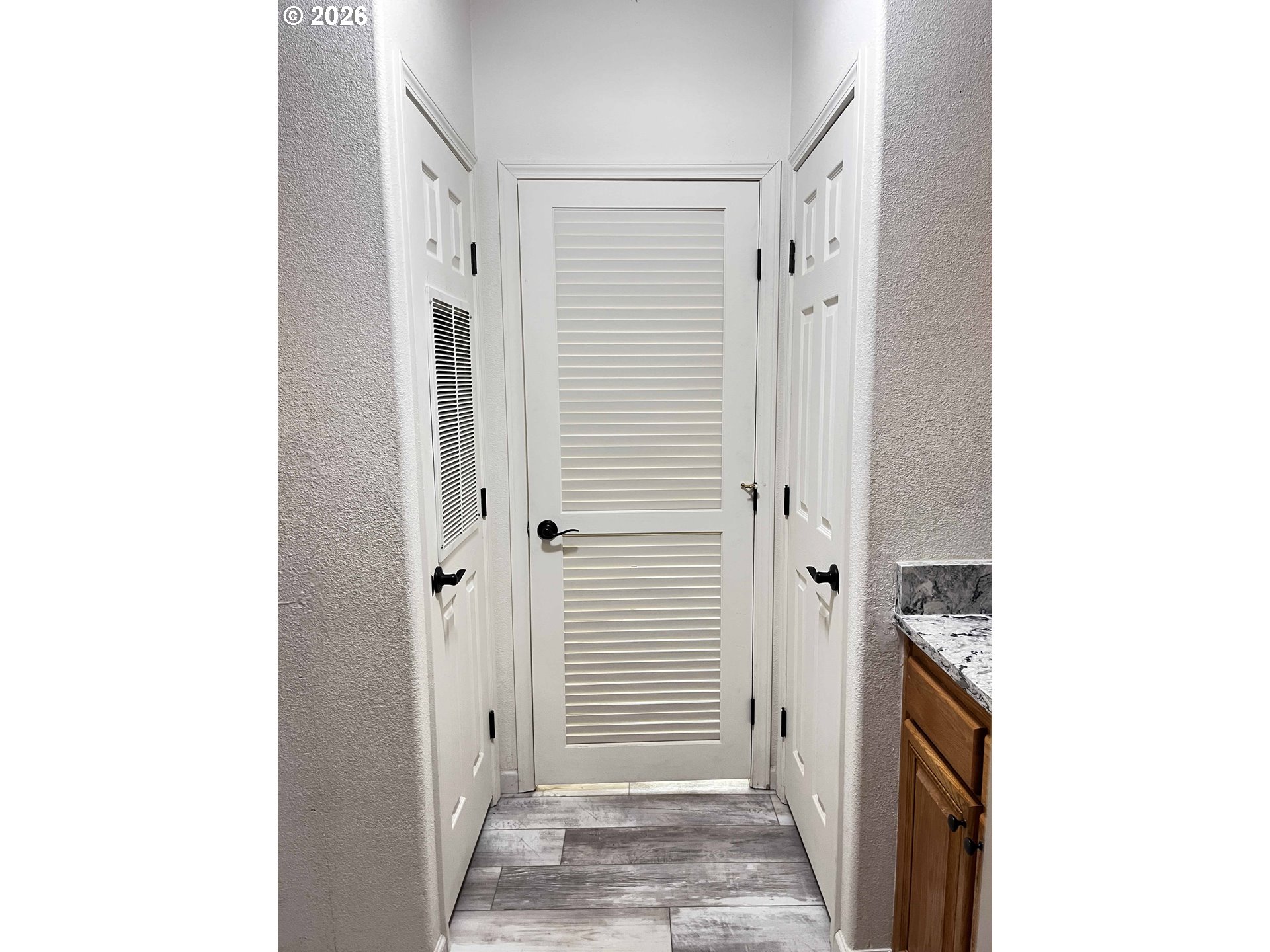 614 38th Place Florence, OR 97439 - Photo 41 of 48 a view of a hallway with closet