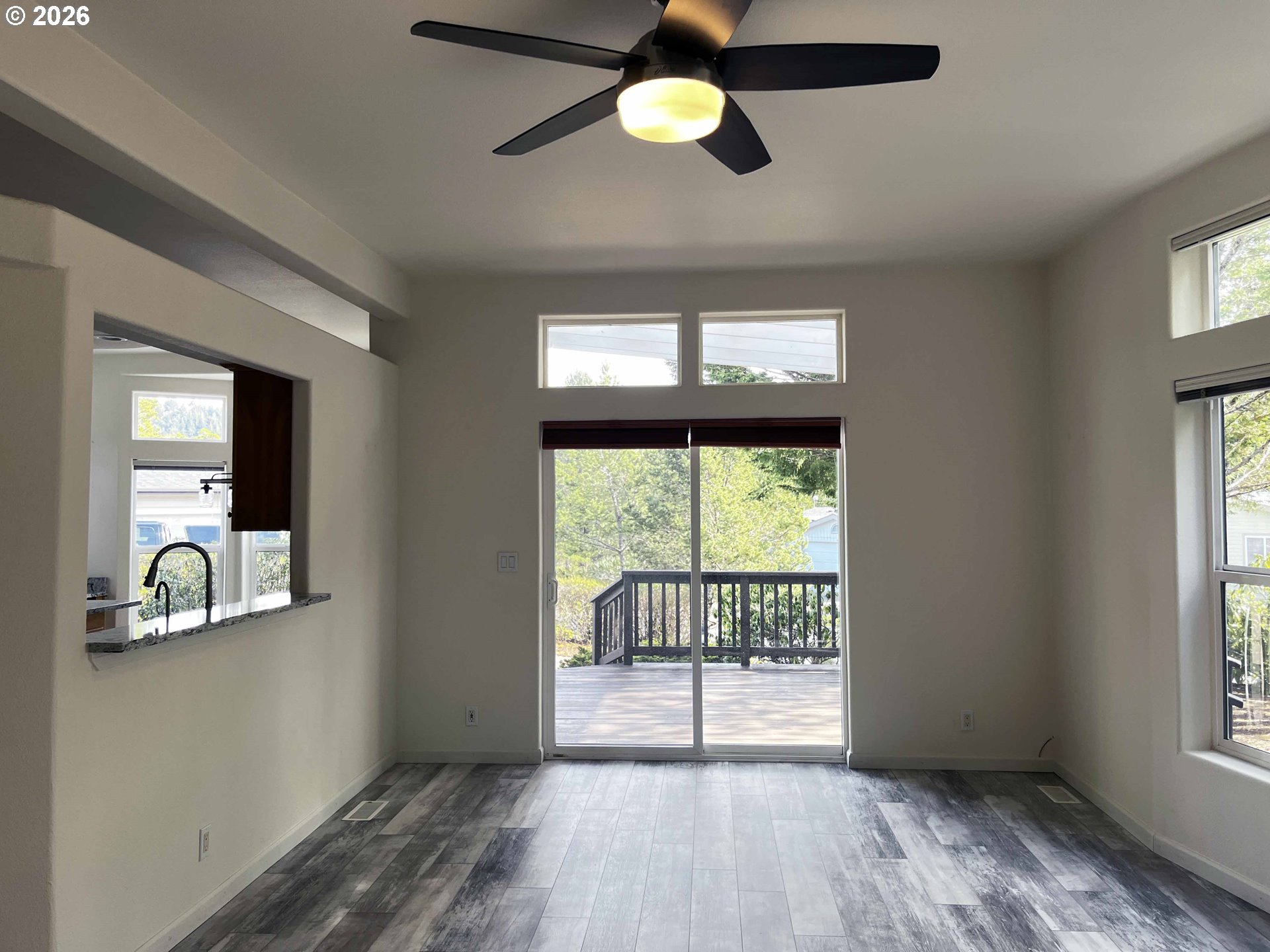 614 38th Place Florence, OR 97439 - Photo 9 of 48 wooden floor in an empty room with a window