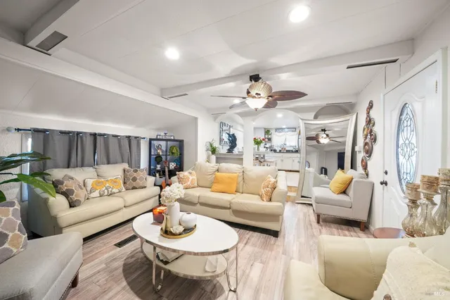 a living room with furniture and a large window