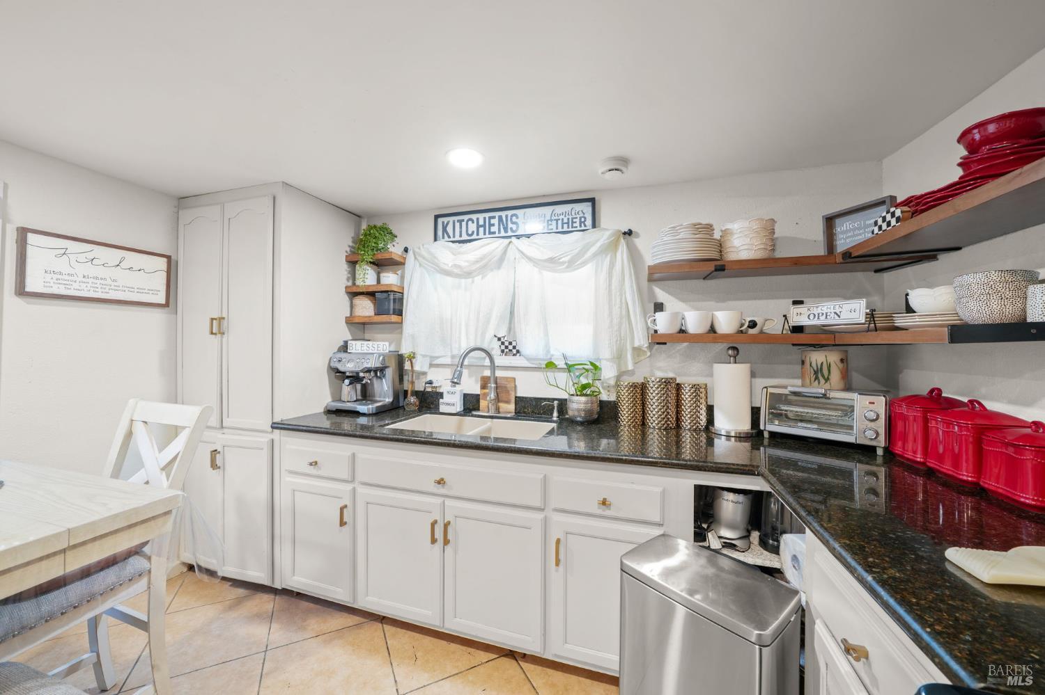 74 Anza Court Fairfield, CA 94533 - Photo 9 of 17 a kitchen with granite countertop a sink a stove and cabinets