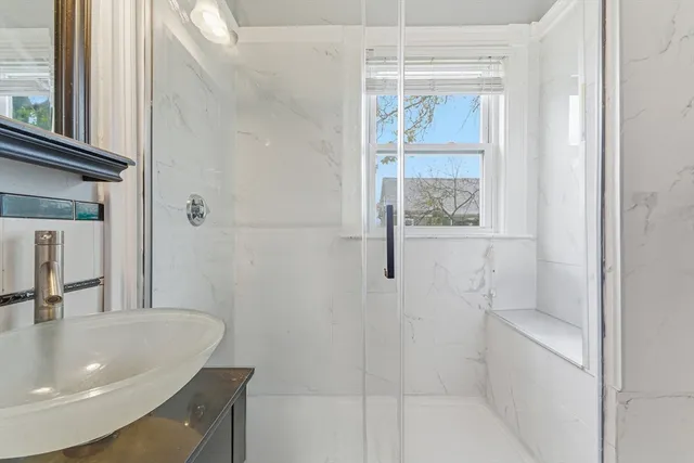 a bathroom with a sink and a window