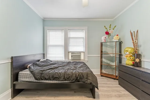a bedroom with a bed and dresser