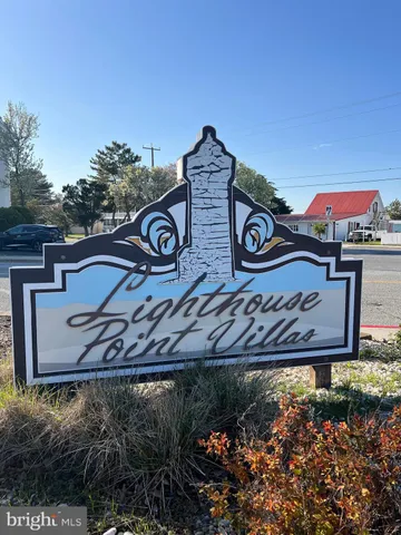 a view of a street with a building in the background