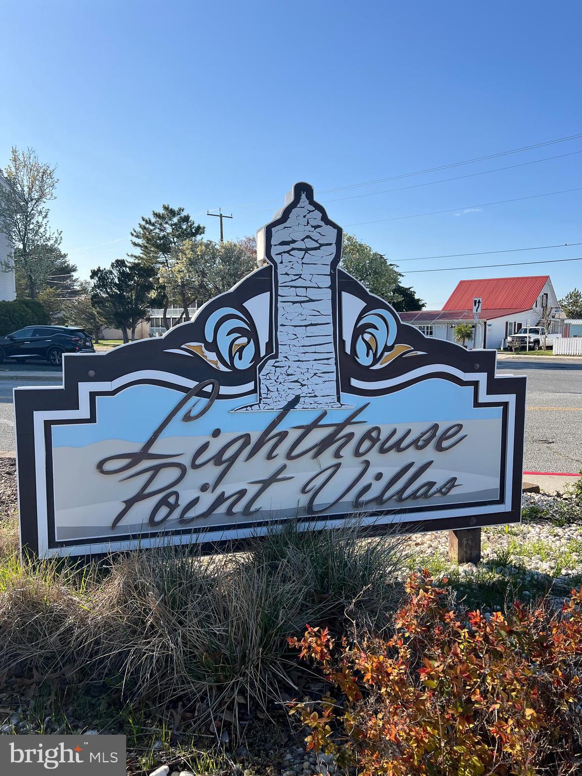 a view of a street with a building in the background