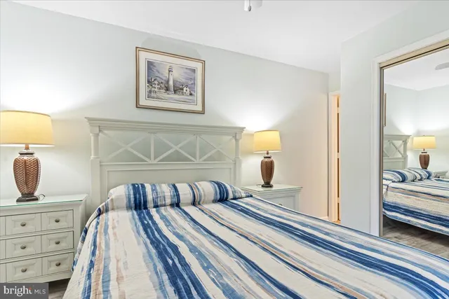 a bedroom with a bed and lamp