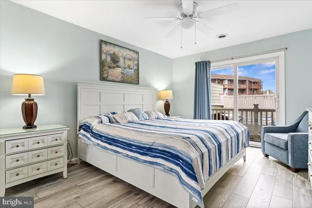 a bedroom with a bed a couch and a window