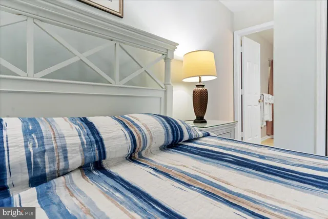 a bathroom with a mirror and vanity