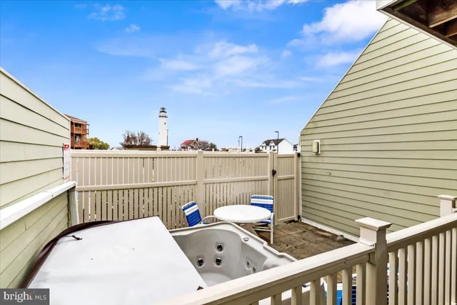 a view of roof deck with furniture