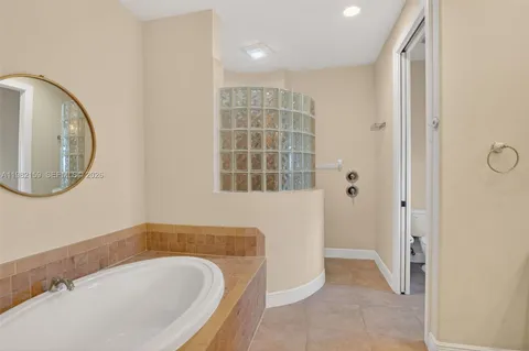 a bathroom with a bathtub and a sink