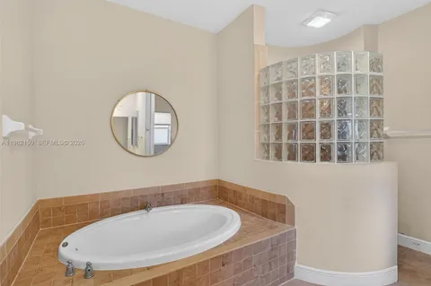a bathroom with a tub and a sink