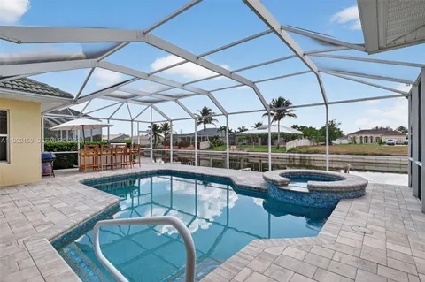 a view of a swimming pool with a patio