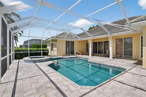 a swimming pool with outdoor seating