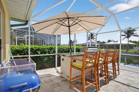 a view of outdoor space with seating area and swimming pool