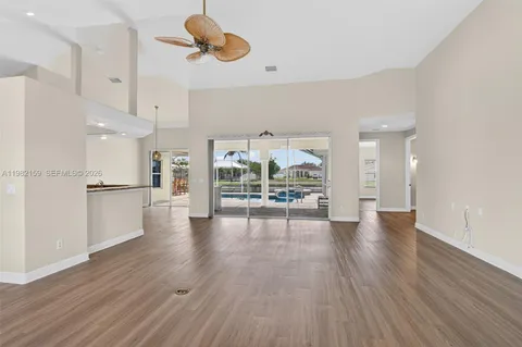 a view of a kitchen with wooden floor