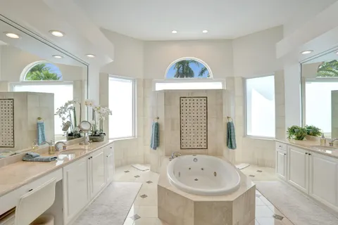 a bathroom with a glass shower door