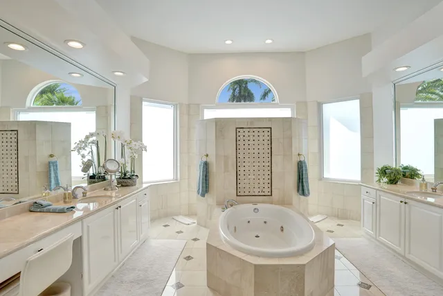 a bathroom with a glass shower door