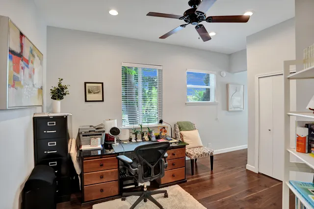 a living room with furniture and a lamp