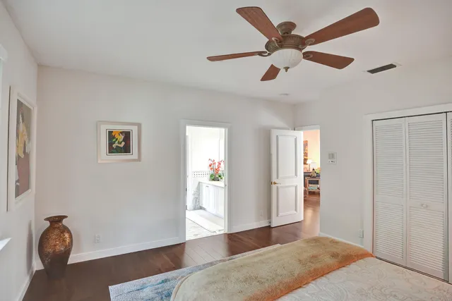 a view of a garden with large trees