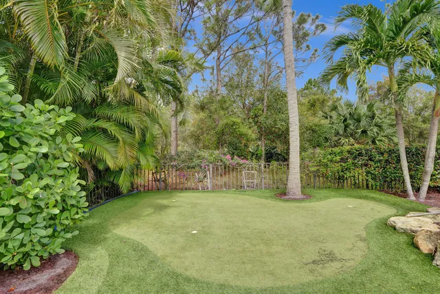 a bathroom with a sink mirror and toilet