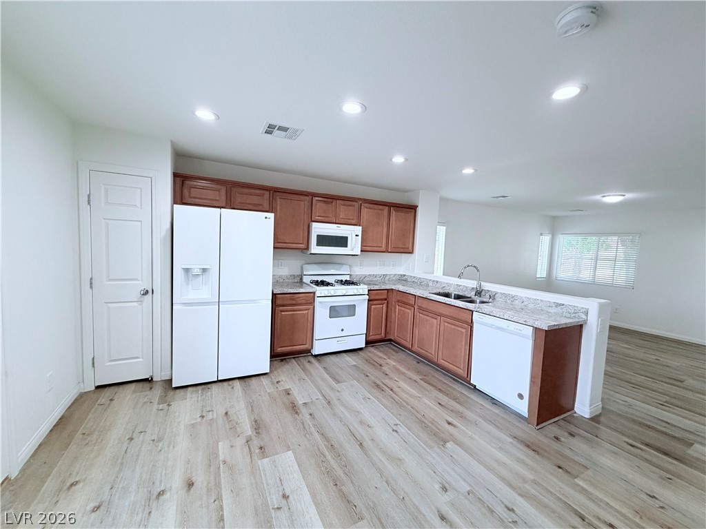 3610 Wireless Court Las Vegas, NV 89129 - Photo 3 of 15 A well-appointed kitchen features ample cabinetry, stone countertops, and modern appliances.