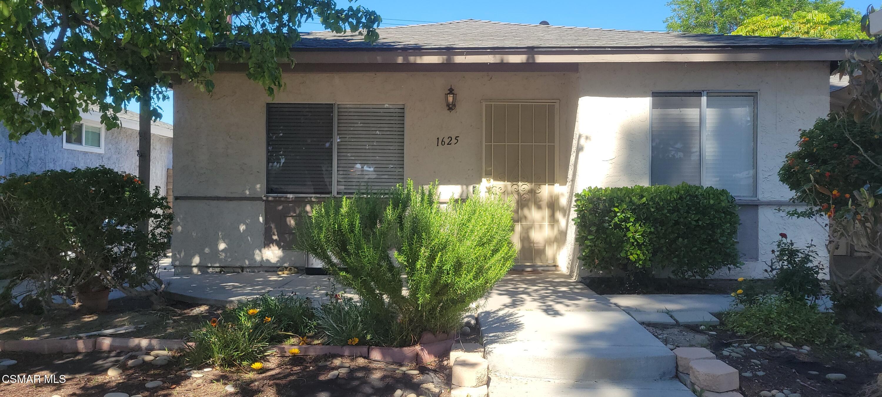 1625 Sequoia Avenue Simi Valley, CA 93063 - Photo 5 of 19 a front view of a house with a yard