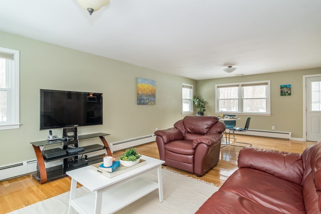 136 Parker Road Framingham, MA 01702 - Photo 11 of 32 a living room with furniture and a flat screen tv