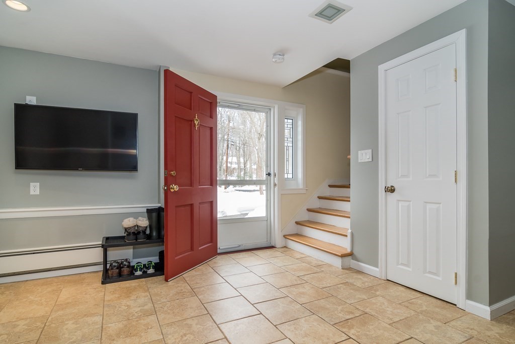 136 Parker Road Framingham, MA 01702 - Photo 12 of 32 a room that has a couch and a flat screen tv