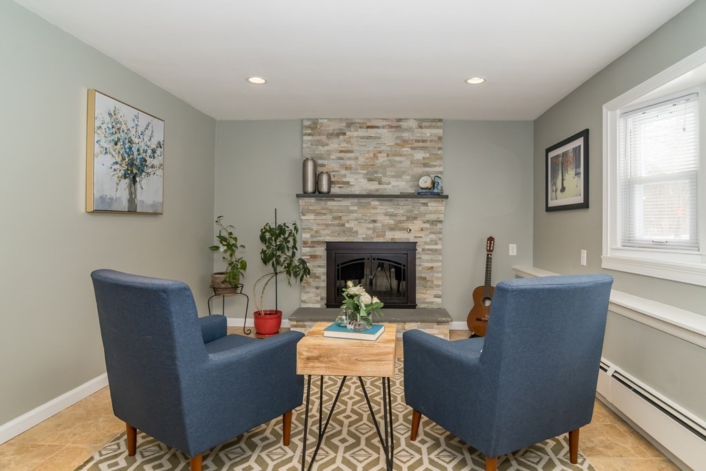 136 Parker Road Framingham, MA 01702 - Photo 14 of 32 a living room with furniture and a fireplace