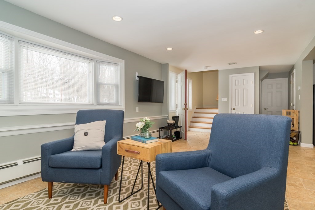 136 Parker Road Framingham, MA 01702 - Photo 16 of 32 a living room with furniture and a flat screen tv