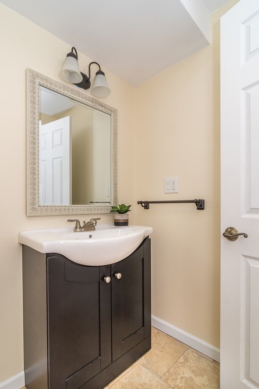 136 Parker Road Framingham, MA 01702 - Photo 17 of 32 a bathroom with a sink and a mirror