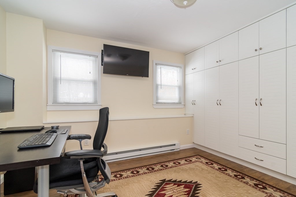 136 Parker Road Framingham, MA 01702 - Photo 18 of 32 a view of a workspace with furniture and a window
