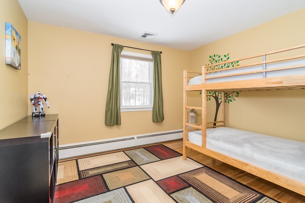 136 Parker Road Framingham, MA 01702 - Photo 24 of 32 a bedroom with a bed and a window
