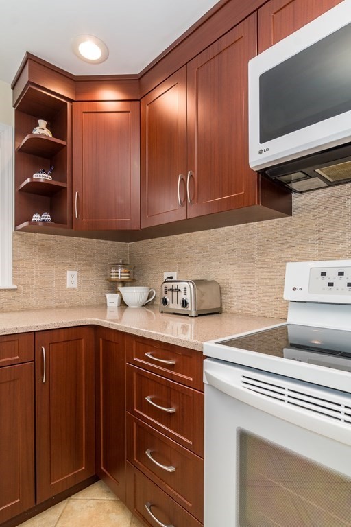 136 Parker Road Framingham, MA 01702 - Photo 5 of 32 a kitchen with a sink and cabinets