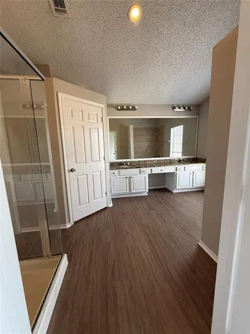 a view of hallway with wooden floor