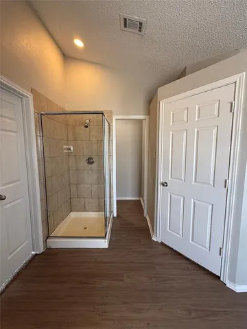 a view of a bathroom with wooden floor