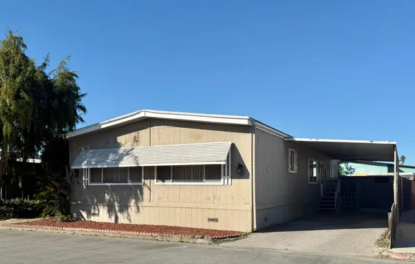 a front view of a house with a garage