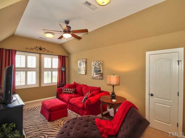 10149 Darling Street Raleigh, NC 27613 - Photo 19 of 25 a bedroom with a bed and a couch