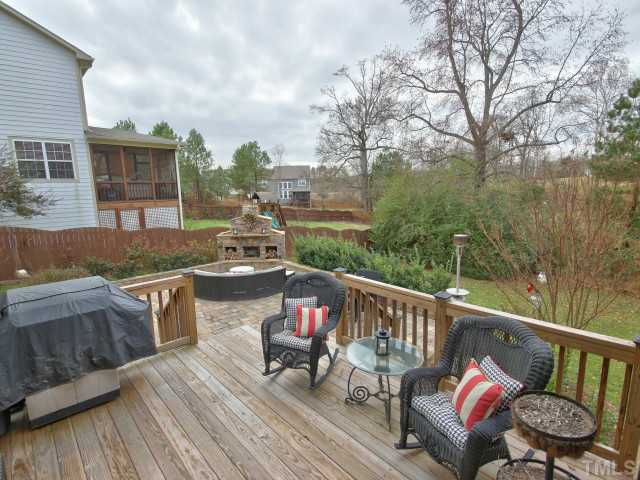 10149 Darling Street Raleigh, NC 27613 - Photo 22 of 25 a terrace with outdoor seating and wooden floor