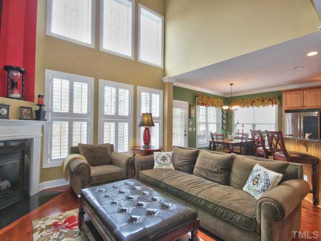 10149 Darling Street Raleigh, NC 27613 - Photo 8 of 25 a living room with furniture fireplace and a large window