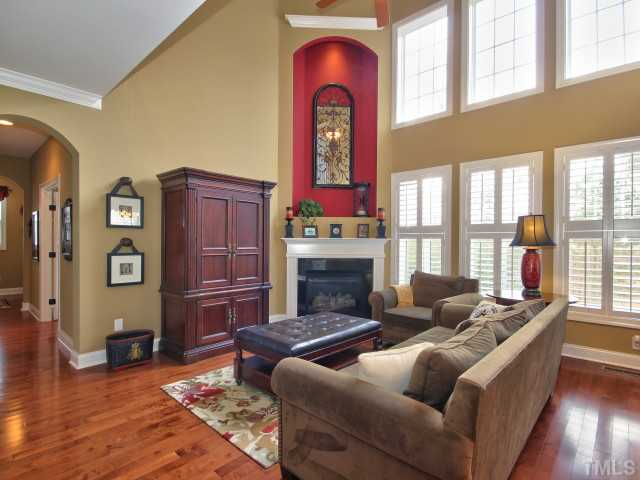 10149 Darling Street Raleigh, NC 27613 - Photo 9 of 25 a living room with furniture fireplace and flat screen tv