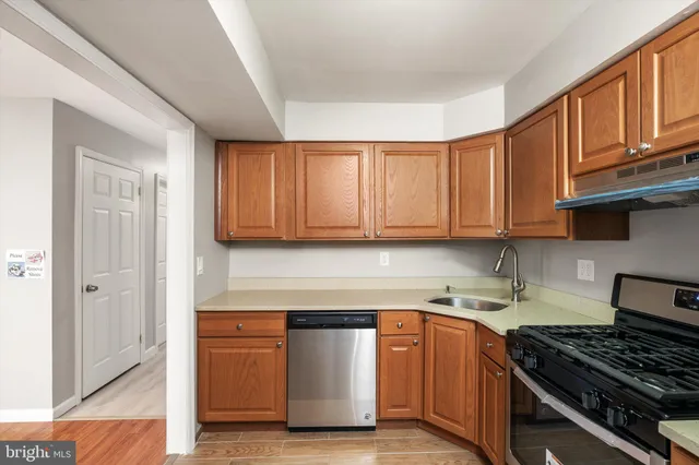 a kitchen with stainless steel appliances granite countertop a stove and a refrigerator