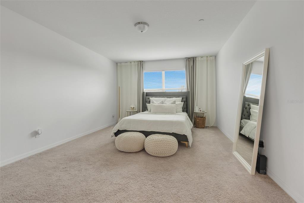 3270 Water Sprite Street Orlando, FL 32808 - Photo 17 of 34 a bathroom with a sink and mirror