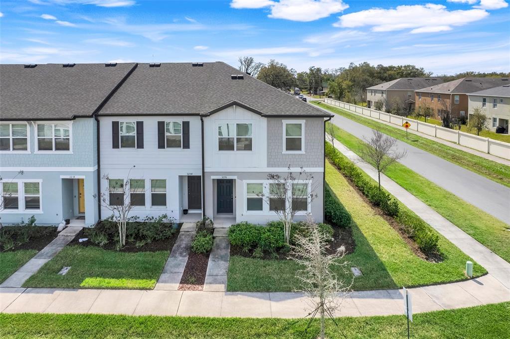 3270 Water Sprite Street Orlando, FL 32808 - Photo 31 of 34 a aerial view of a house next to a yard